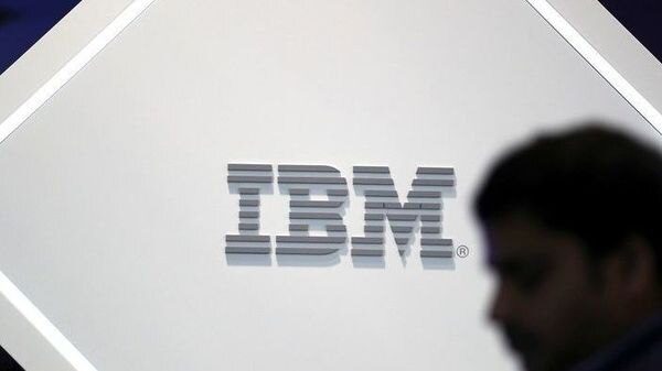 A man stands near an IBM logo . (Photo: Reuters) (REUTERS)