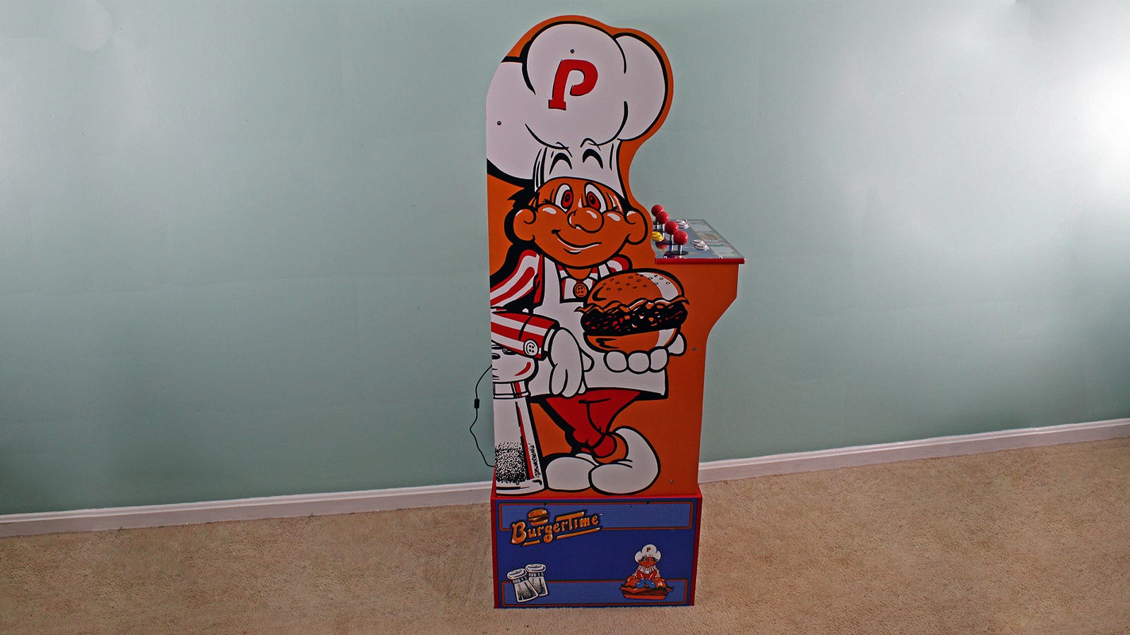 Sidovy av Burger Time-maskinen som visar profilen i form av en kockmössa.