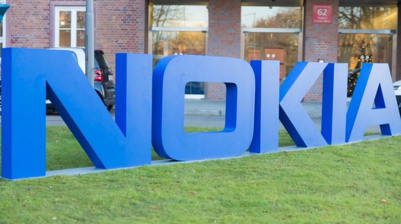 The new chips can cut in half the size of antennas in cell towers while cutting their power consumption by two-thirds. (Nokia logo)