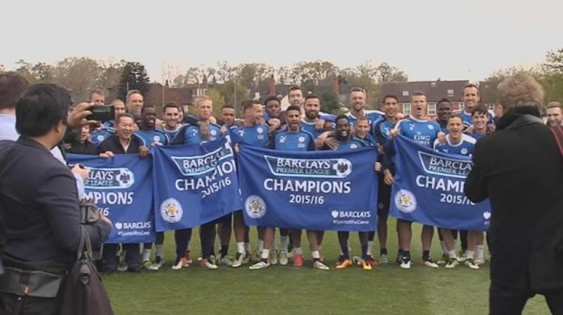 Leicester City celebrate after winning their first ever Premier League trophy.