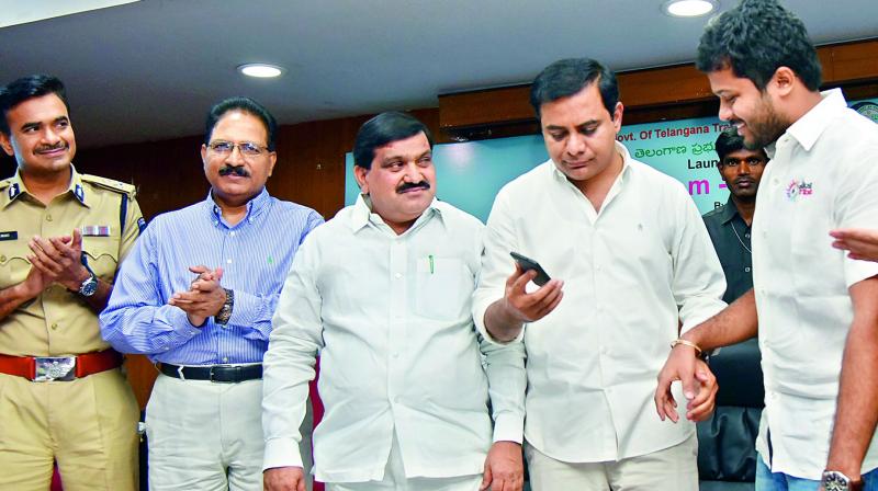 Telangana minister for transport Mahender Reddy and minister for IT K.T. Rama Rao at the launch of RTA m-Wallet in Hyderabad on Wednesday. (Photo: DC)