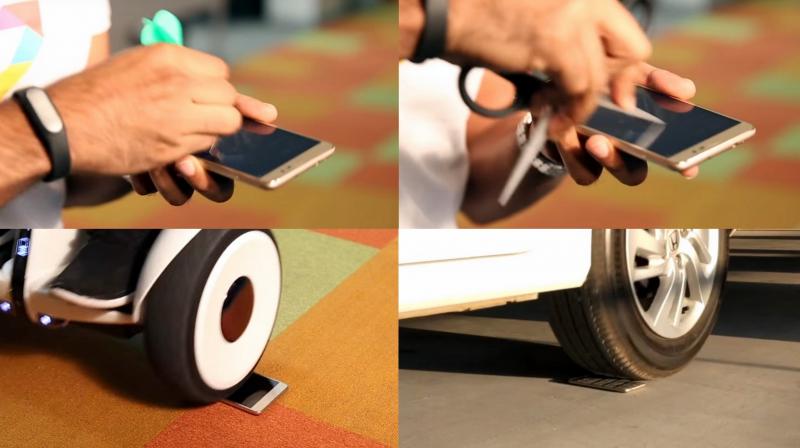 Xiaomi ran both the front and rear tires over the Redmi Note 3, with more than 1,000 kilos of weight, to show the display’s and phone’s rugged build.
