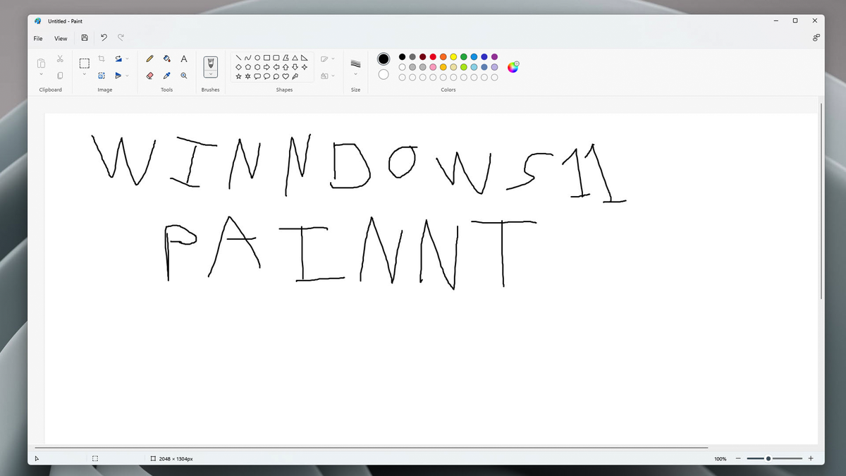 Kami menulis "WIN 11 PAIN" di aplikasi Paint untuk mengejek kesalahan ketik Microsoft.