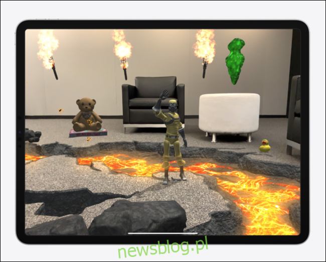 Đồ chơi, nhân vật và phong cảnh ảo trong phòng khách Trải nghiệm thực tế tăng cường trên iPad Pro.